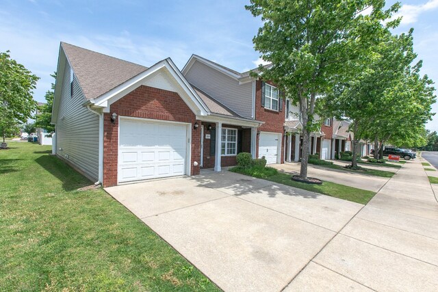 2026 Caladonia Way, Smyrna, TN 37167 - view of front of property with concrete driveway, brick siding, a front lawn, an attached garage, and a shingled roof