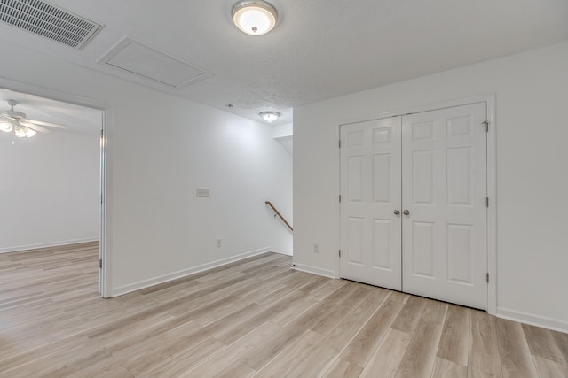 2026 Caladonia Way, Smyrna, TN 37167 - basement featuring light wood-style floors, baseboards, a ceiling fan, and a textured ceiling