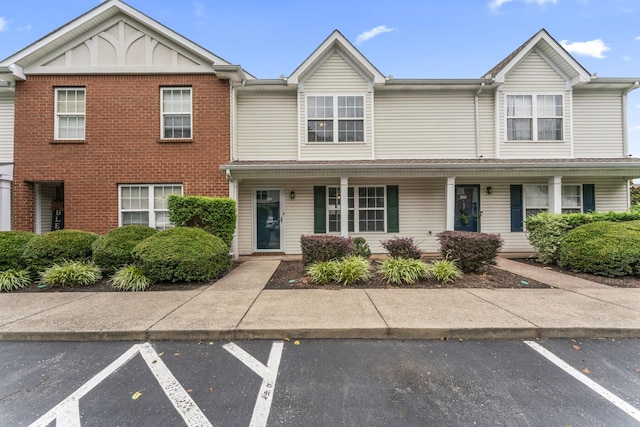 304 Shoshone Pl, Murfreesboro, TN 37128 - multi unit property featuring uncovered parking, brick siding, and a porch