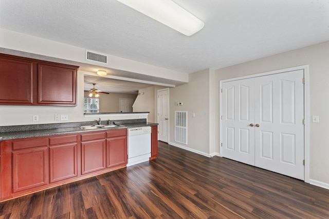 304 Shoshone Pl, Murfreesboro, TN 37128 - kitchen featuring white dishwasher, dark wood finished floors, dark countertops, and dark brown cabinets