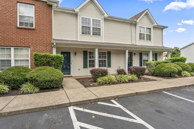 304 Shoshone Pl, Murfreesboro, TN 37128 - townhome / multi-family property featuring uncovered parking and covered porch