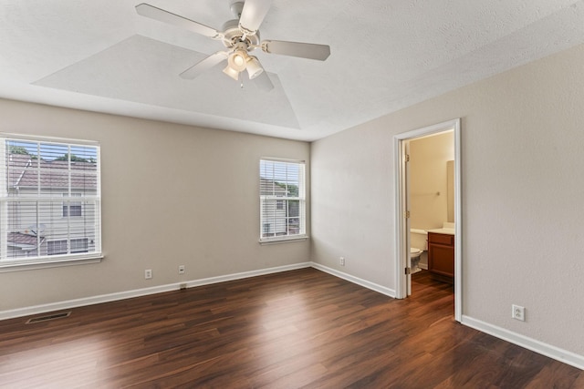 304 Shoshone Pl, Murfreesboro, TN 37128 - unfurnished bedroom featuring dark wood-style flooring, multiple windows, a ceiling fan, and ensuite bathroom