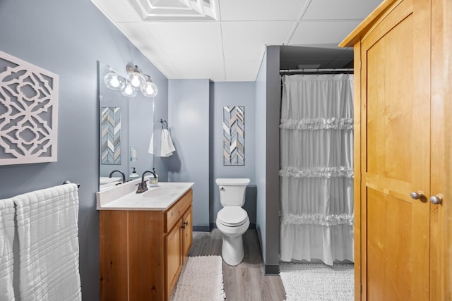 211 Hood St, Dover, TN 37058 - bathroom featuring vanity, toilet, wood finished floors, a drop ceiling, and curtained shower