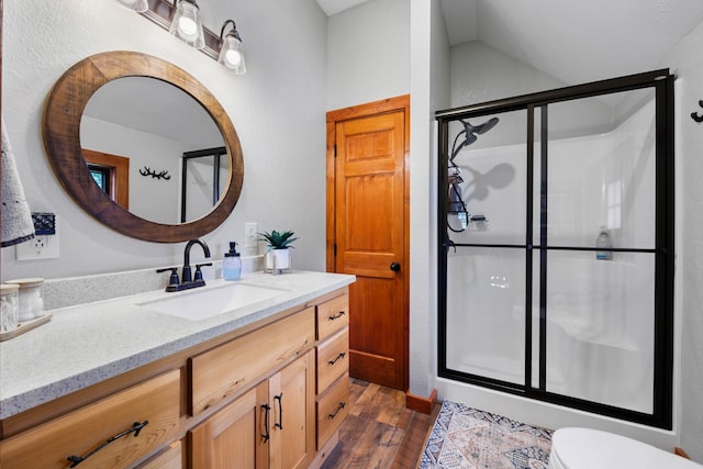 211 Hood St, Dover, TN 37058 - full bathroom featuring vanity, a shower stall, wood finished floors, and toilet