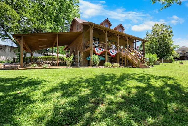 211 Hood St, Dover, TN 37058 - back of house featuring stairway and a yard