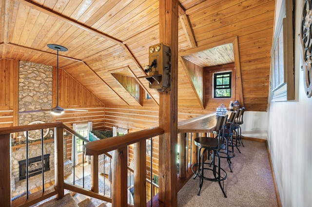 211 Hood St, Dover, TN 37058 - corridor featuring wood ceiling, wood walls, an upstairs landing, vaulted ceiling, and carpet