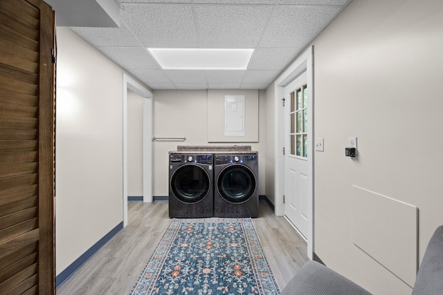 211 Hood St, Dover, TN 37058 - washroom featuring independent washer and dryer, light wood-style flooring, baseboards, and electric panel