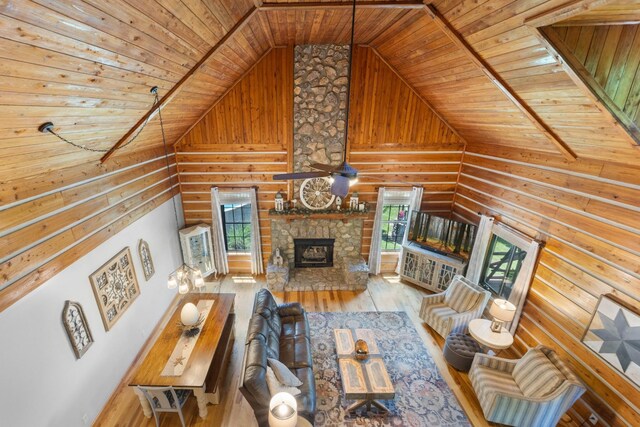 211 Hood St, Dover, TN 37058 - living room featuring wood ceiling, lofted ceiling, rustic walls, hardwood / wood-style flooring, and a fireplace