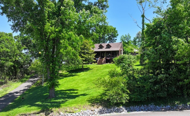 211 Hood St, Dover, TN 37058 - view of front of property with a front lawn, a wooden deck, and stairs