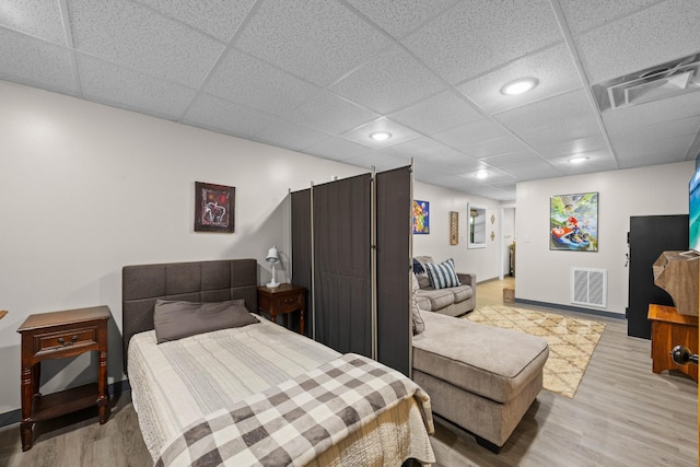 211 Hood St, Dover, TN 37058 - bedroom featuring light wood-style floors, recessed lighting, baseboards, and a paneled ceiling