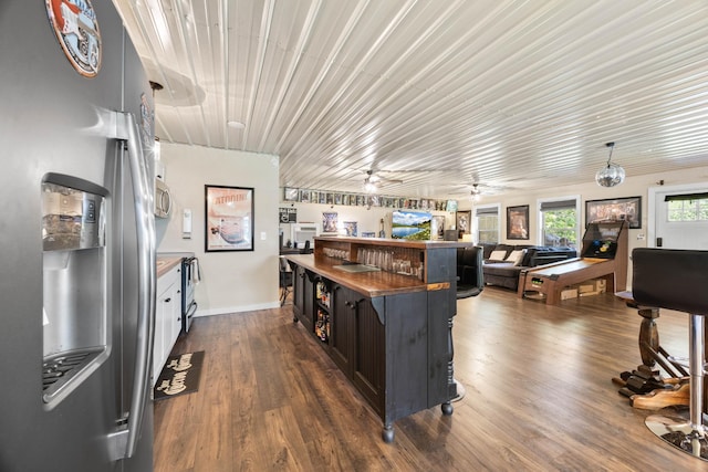 211 Hood St, Dover, TN 37058 - kitchen featuring stainless steel appliances, baseboards, dark wood finished floors, open floor plan, and ceiling fan