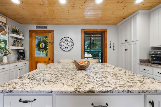 211 Hood St, Dover, TN 37058 - kitchen with wooden ceiling, open shelves, white cabinets, recessed lighting, and light stone counters
