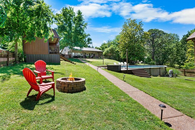 211 Hood St, Dover, TN 37058 - view of yard featuring an outdoor fire pit and an outdoor pool