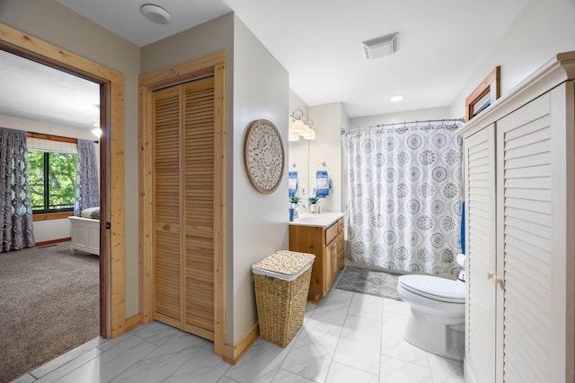 211 Hood St, Dover, TN 37058 - full bathroom with a closet, vanity, marble finish floors, toilet, and baseboards