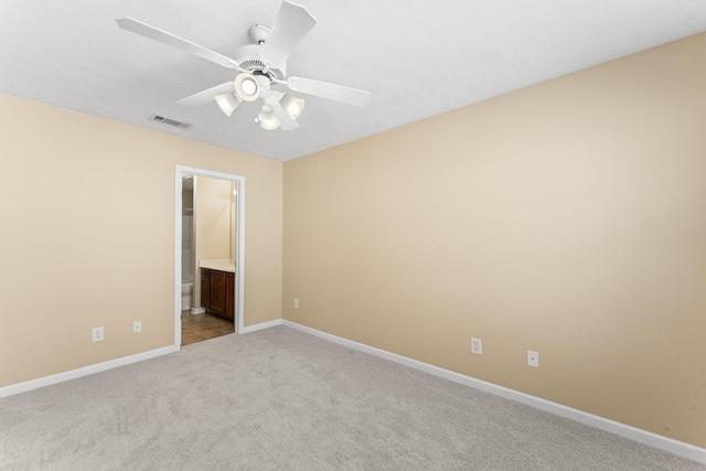 1036 Harold Lee Dr, Smyrna, TN 37167 - unfurnished bedroom featuring light carpet, baseboards, ensuite bathroom, and ceiling fan