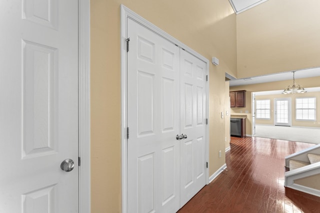 1036 Harold Lee Dr, Smyrna, TN 37167 - hallway with a chandelier, dark wood-style floors, baseboards, and stairs