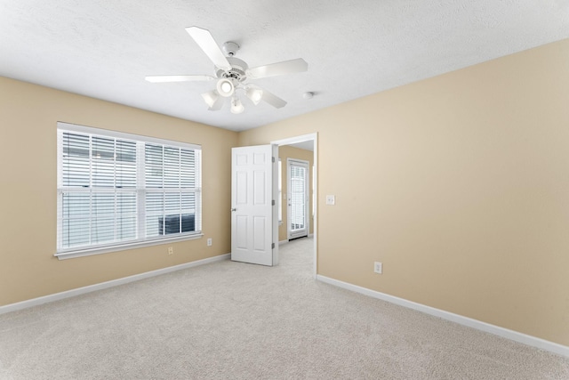 1036 Harold Lee Dr, Smyrna, TN 37167 - unfurnished bedroom featuring baseboards, light carpet, a ceiling fan, and a textured ceiling