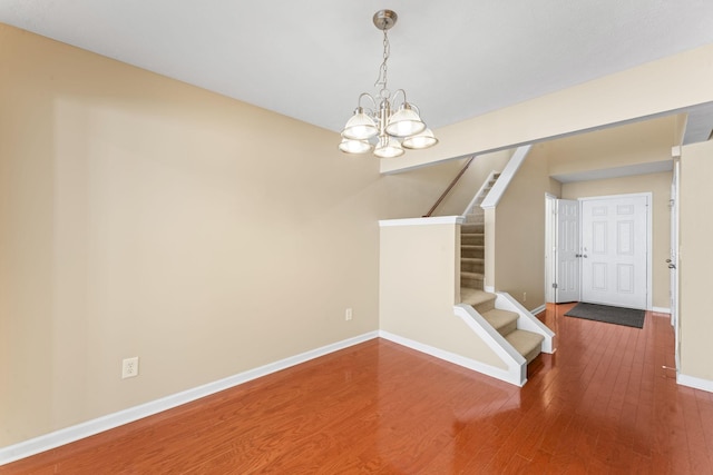 1036 Harold Lee Dr, Smyrna, TN 37167 - unfurnished room with a chandelier, wood finished floors, stairs, and baseboards