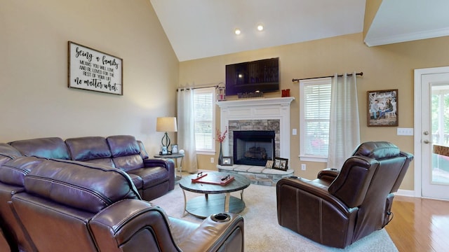 1032 Stonehollow Way, Mount Juliet, TN 37122 - living area featuring wood finished floors, a fireplace, plenty of natural light, vaulted ceiling, and baseboards