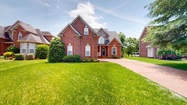 1032 Stonehollow Way, Mount Juliet, TN 37122 - view of front facade featuring brick siding, a front yard, and driveway
