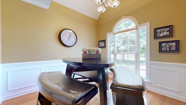 1032 Stonehollow Way, Mount Juliet, TN 37122 - dining room featuring a chandelier, a decorative wall, wainscoting, vaulted ceiling, and light wood-style flooring