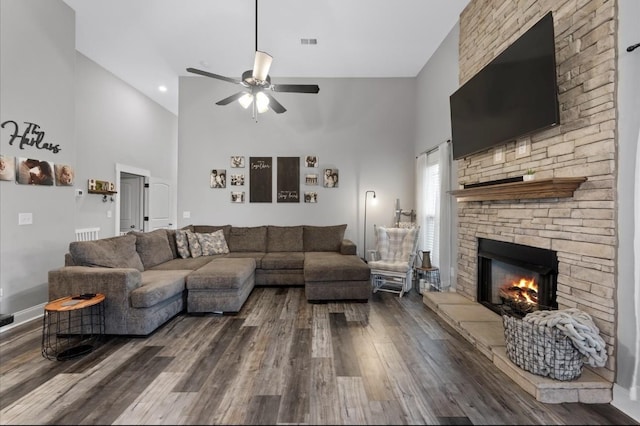 720 Jersey Dr, Clarksville, TN 37043 - living area with high vaulted ceiling, dark wood finished floors, a fireplace, a ceiling fan, and baseboards