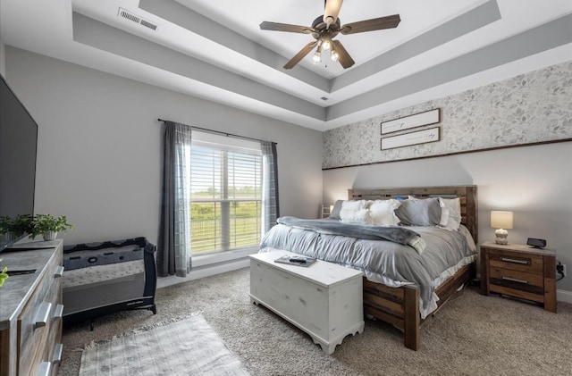 720 Jersey Dr, Clarksville, TN 37043 - carpeted bedroom featuring a tray ceiling, a ceiling fan, and baseboards