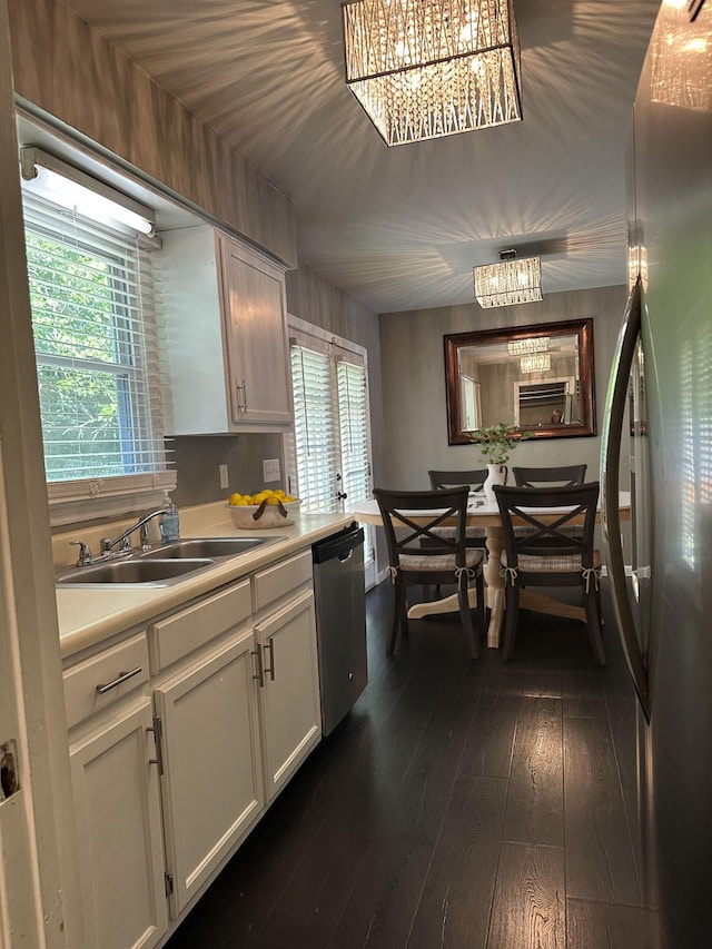 1016 Silver Point Dr, Murfreesboro, TN 37130 - kitchen with appliances with stainless steel finishes, a sink, light countertops, white cabinets, and dark wood-type flooring