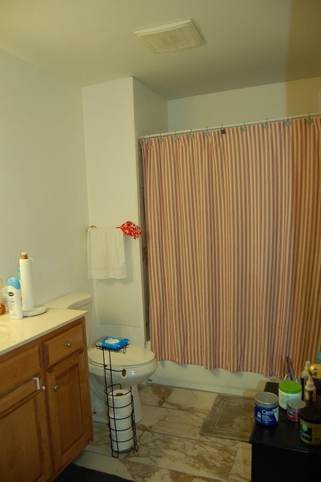 125 Ellington Pl, Madison, TN 37115 - bathroom with marble look tile flooring, toilet, shower / bath combo, and vanity