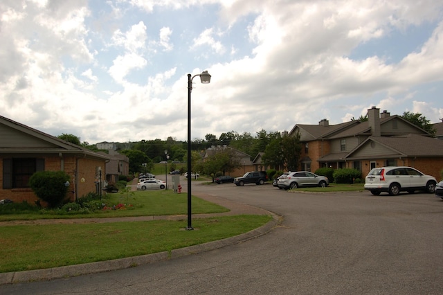 125 Ellington Pl, Madison, TN 37115 - view of asphalt street featuring street lights, a residential view, and curbs