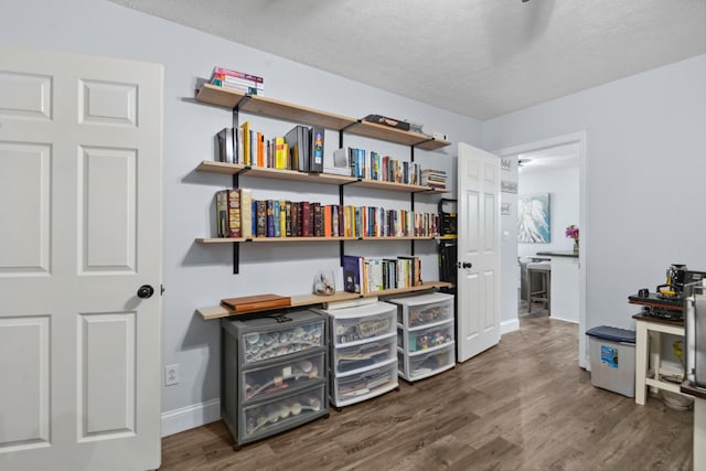 530 Maplewood Dr, Cornersville, TN 37047 - miscellaneous room featuring wood finished floors, a textured ceiling, and baseboards