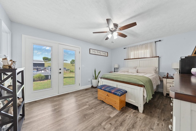 530 Maplewood Dr, Cornersville, TN 37047 - bedroom featuring french doors, access to outside, wood finished floors, a textured ceiling, and ceiling fan