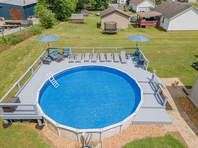 530 Maplewood Dr, Cornersville, TN 37047 - view of pool with a deck, a trampoline, and a lawn