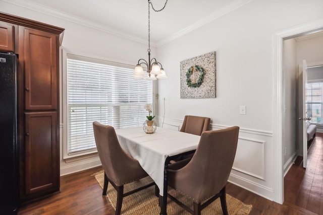 816 General Cabot Ct, Murfreesboro, TN 37129 - dining area with a chandelier, dark wood-style floors, crown molding, and a decorative wall