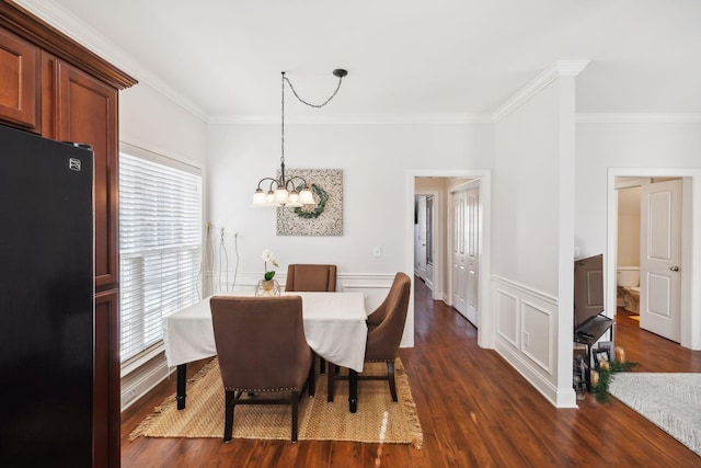 816 General Cabot Ct, Murfreesboro, TN 37129 - dining area with ornamental molding, a chandelier, dark wood-style floors, and wainscoting