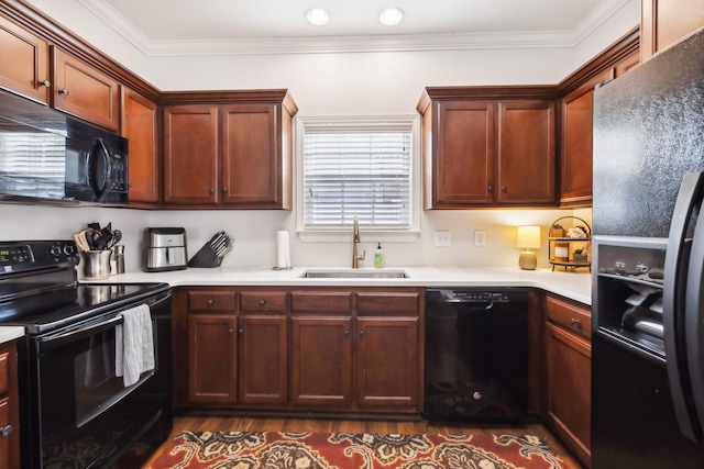 816 General Cabot Ct, Murfreesboro, TN 37129 - kitchen featuring black appliances, a sink, dark wood finished floors, ornamental molding, and light countertops