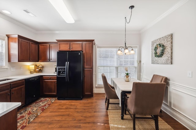 816 General Cabot Ct, Murfreesboro, TN 37129 - kitchen with black appliances, ornamental molding, light countertops, dark wood-style floors, and a chandelier