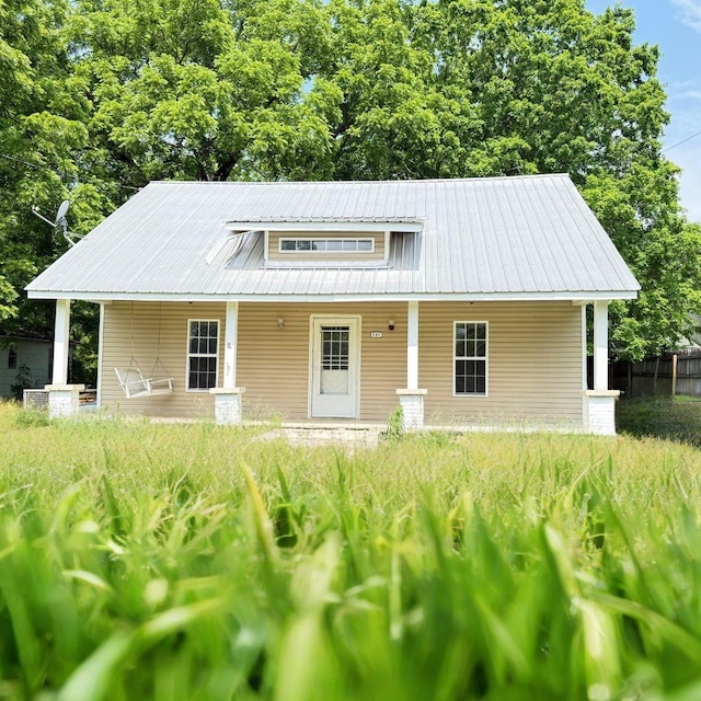 249 Flintville Rd, Flintville, TN 37335 - bungalow-style house with a porch and metal roof
