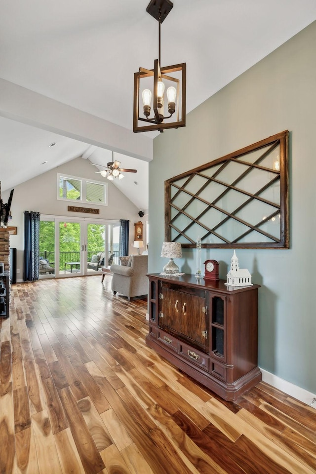 225 Ferguson Creek Rd, Sparta, TN 38583 - hallway featuring a chandelier, wood-type flooring, high vaulted ceiling, and baseboards
