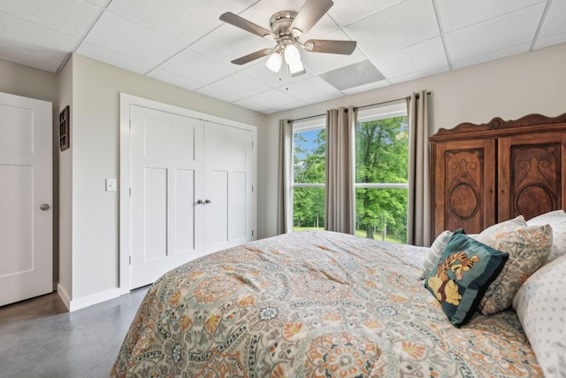 225 Ferguson Creek Rd, Sparta, TN 38583 - bedroom featuring finished concrete flooring, a paneled ceiling, baseboards, a closet, and ceiling fan