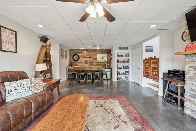 225 Ferguson Creek Rd, Sparta, TN 38583 - living room featuring concrete flooring, built in shelves, a ceiling fan, recessed lighting, and baseboards