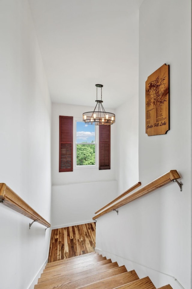 225 Ferguson Creek Rd, Sparta, TN 38583 - stairs featuring a chandelier, baseboards, and wood finished floors