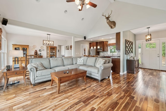 225 Ferguson Creek Rd, Sparta, TN 38583 - living area with light wood-style flooring, ceiling fan, a chandelier, and high vaulted ceiling