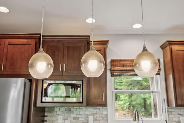 225 Ferguson Creek Rd, Sparta, TN 38583 - kitchen view of stainless steel appliances, decorative backsplash, and decorative light fixtures