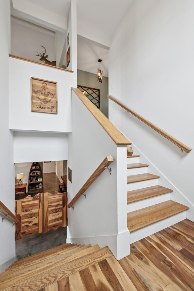 225 Ferguson Creek Rd, Sparta, TN 38583 - stairway featuring wood finished floors and a chandelier