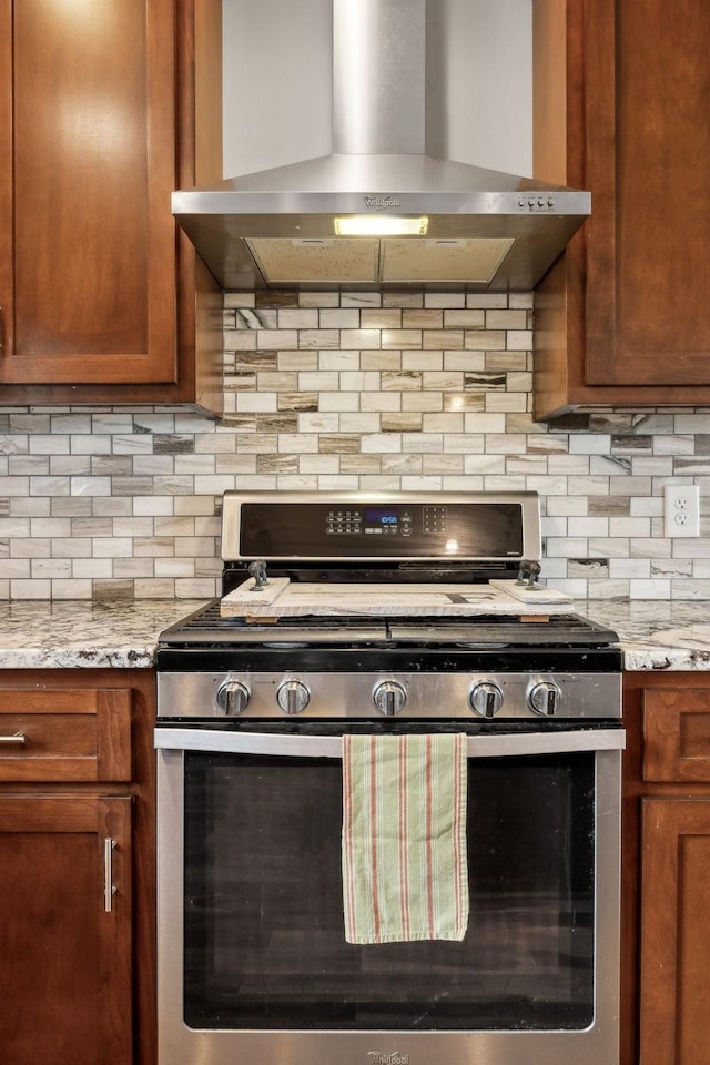 225 Ferguson Creek Rd, Sparta, TN 38583 - kitchen with gas range, range hood, backsplash, and brown cabinetry