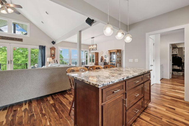 225 Ferguson Creek Rd, Sparta, TN 38583 - kitchen with a breakfast bar, dark wood-type flooring, french doors, decorative light fixtures, and a ceiling fan