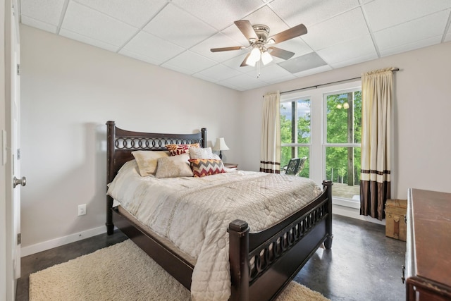 225 Ferguson Creek Rd, Sparta, TN 38583 - bedroom with a drop ceiling, finished concrete floors, baseboards, and a ceiling fan