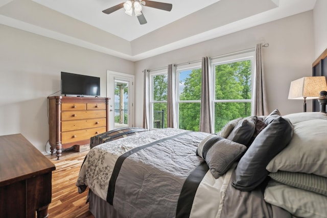 225 Ferguson Creek Rd, Sparta, TN 38583 - bedroom featuring a raised ceiling, wood finished floors, and a ceiling fan