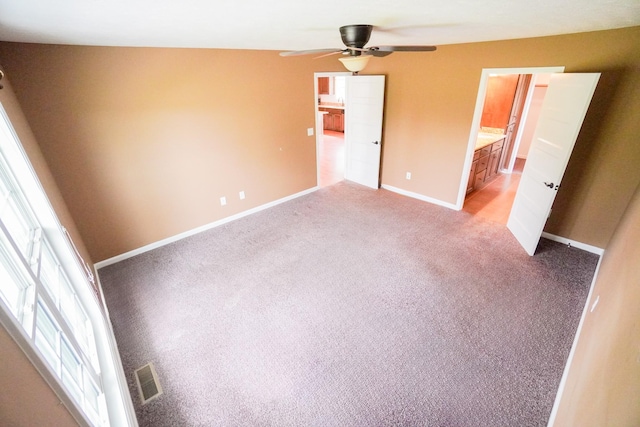 41 Haven Way, Westmoreland, TN 37186 - unfurnished bedroom featuring light carpet, baseboards, ensuite bathroom, and a ceiling fan